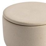 Ceramic serving plates with fresh fruit and seasoning bowls on marble surface