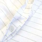 Close-up of Blake White/Ocean Duvet button closure highlighting textured interwoven stripes