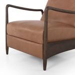 Close-up of leather seat cushion and armrest frame junction
