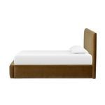 Side profile of Quincy Bed highlighting thick padding and smooth upholstery on headboard and frame