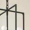 Close-up of textured black iron frame and chain link at top of Kael Lantern