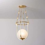 Verbank pendant hanging from ceiling in a minimal room setting with white walls