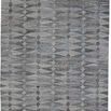 Beckett Light/Dark Gray Diamond Rug with geometric diamond pattern in varying gray shades and fringe edges