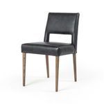 Three-quarter front angle showing chair seat, backrest cutout, and angled legs