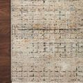 Detailed close-up of rug corner on dark hardwood floor showing color variation and edging