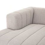 Wide arm with vertical channeling and part of the chaise on Langham sectional