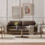 Cronos end table styled next to beige armchairs and brown sofa in living room setting