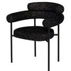 Angled front side view showing curved armrest and seat cushion of Portia dining chair
