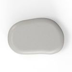 Top view of pebble coffee table revealing asymmetrical organic shape and smooth surface texture in light gray