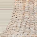 Close-up view of the textured whitewashed seagrass weave with small light spots showing through