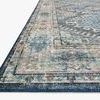 Close-up angled view showing edge and detailed print texture of Skye Denim Natural Rug