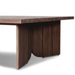 Close-up of table corner focusing on teak wood surface and leg junction