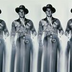 Detail close-up of Ronald Reagan's torso and belt area in repeated cowboy photo with blurred skirt