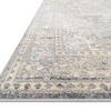 Close-up angled view of Lucia rug showing detailed border pattern and soft pile texture