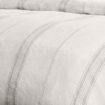 Close-up view highlighting the linen cashmere blend fabric and fine gray stripes on the duvet