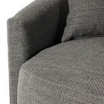 Detail close-up of armrest edge's tight seam and fabric texture