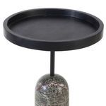 Closer angle focusing on the black wood tray top and top portion of the marble base