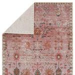 Back side of rug showing lighter faded colors and edge stitching