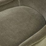 Close-up of Blaire Dining Chair seat cushion and curved armrest with plush velvet texture