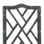 Detailed view of upper backrest’s bamboo-style carving and sculpted shape