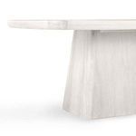 Close-up side view focusing on the junction between the whitewash oak tabletop and pedestal base