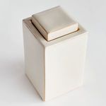 Angled view highlighting smooth reactive glaze and soft shadowing on jar and lid