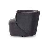 Side angle capturing full chair profile with visible swivel base under cushion