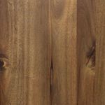 Close-up on acacia wood texture showing natural knots and grain variations