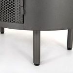 Close-up of cylindrical gunmetal nightstand leg and perforated door corner