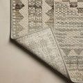 Corner of rug folded to reveal the tightly woven underside pattern of Saylor Granite Veil Rug