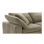 Close-up of left armrest with overlapping plush cushions and soft fabric texture