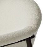 Back legs of stool showing angled wood and clean stitching along cushion edge
