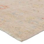Close-up view showing the rug’s soft, flat texture and subtle floral pattern in pastel colors