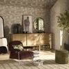 Camino Ottoman placed in a cozy living room setting with decorative furniture and natural light
