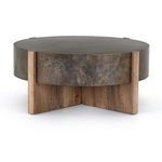 Side close-up focusing on oak leg texture and joined iron drum top