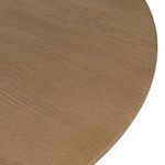 Close-up of rounded tabletop edge highlighting oak veneer texture and finish.