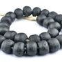 Low angle with beads coiled together showing subtle matte texture and irregular shapes