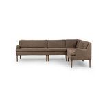 L-shape dining banquette with sloping track arms, tapered wooden legs, and 100% linen upholstery in warm brown.