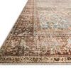 Close-up angled corner view showing rug’s stitched edges and vintage worn details