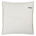 Back of pillow with visible sew-on brand label on ivory fabric