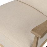 Top view close-up of beige cushioned seat and armrest on Godfrey Chair
