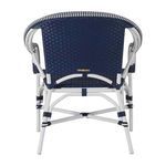 Back view of outdoor accent chair showing navy woven back and white frame supporting structure