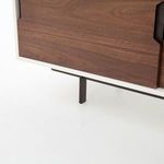 Close-up of bottom corner showing walnut door panel and black metal leg