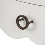 Close-up of round dark metal drawer pull on white Scarlett 1-Drawer End Table