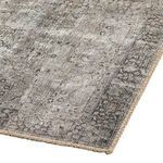 Angled corner close-up showcasing rug texture, faded design, and woven jute detail