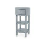 Claudette 1-Drawer Round Side Table with washed lacquered linen finish on modern structured form with round top and two sh...