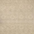 Hand-tufted wool area rug in natural hues with ribbed high-low pile and subtle circular motifs