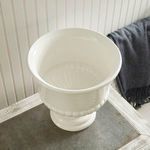Top angled view inside pedestal bowl revealing smooth white interior bottom pattern