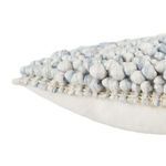 Detailed side angle focusing on soft textured wool loops and layered construction