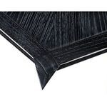 Extreme close-up of pointed corner detail on table top edge with visible wood grain